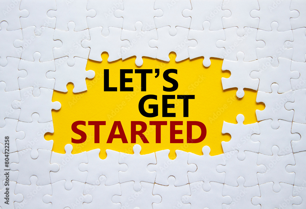 Wall mural lets get started symbol. concept words lets get started on white puzzle. beautiful yellow background