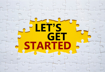 Lets get started symbol. Concept words Lets get started on white puzzle. Beautiful yellow...