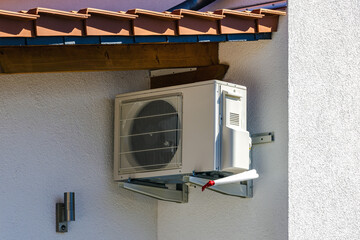 Air conditioning unit on house facade