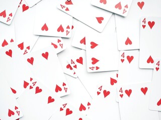 Poker background with a lot of four of hearts playing cards for Magic tricks
