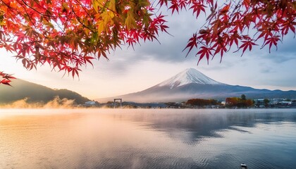 colorful autumn season and mountain fuji with morning fog and red leaves at lake kawaguchiko is one...
