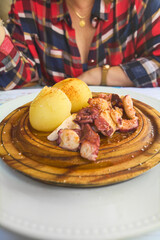 Seafood delicacy: soft octopus and potatoes in rustic presentation for authentic culinary experiences