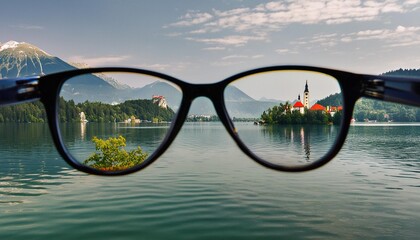 glasses monastery on the water seen through eyeglass lenses lake bled