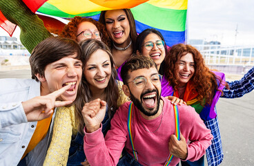 LGBT community people with rainbow flag celebrating gay pride day festival. Gay and lesbian people concept.