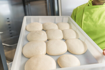 pizza dough balls, getting ready to make pizza in the restaurant. High quality photo