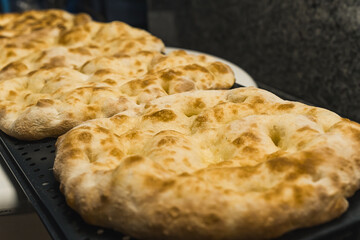 impala pizza circles, baking process, italian cuisine concept. High quality photo