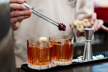 The bartender prepares cocktails for the client.
