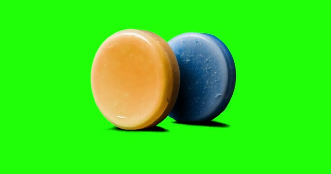 Soap filmed in stop motion against chroma key background. piece of crumpling paper on green screen. Colorful animation for creating logotype