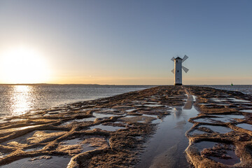lighthouse mill on the seashore in Swinoujscie in Poland in spring