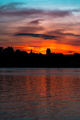 Fototapeta premium sunset against the background of silhouettes of the city of Warsaw in Poland in the spring