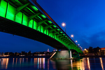 evening view of the Warsaw embankment in Poland and the royal palace