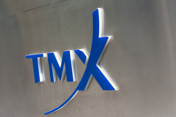 Obraz premium close-up of TMX Group logo on sidewalk branding sign outside Richmond-Adelaide Centre in Toronto, Canada