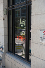 Obraz premium oblique angle view of sign inside window at Thor Espresso Bar Queen West in Toronto, ON