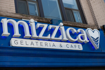 Obraz premium exterior building facade and sign of Mizzica Gelateria & Cafe, an ice cream shop, located at 307 Queen Street West in Toronto, Canada