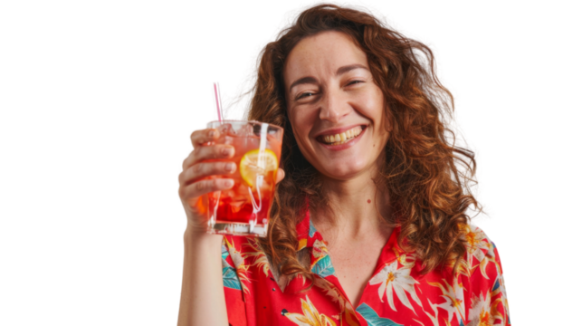 Happy caucasian middle age female tourist in a red shirt toasting with a cocktail white background