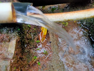 Flowing Elegance: Water Streaming from PVC Pipe