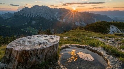 Idyllic landscape in the summer against sunset sky, in Wetterstein mountains. Mountain fountain made from a wooden trunk.