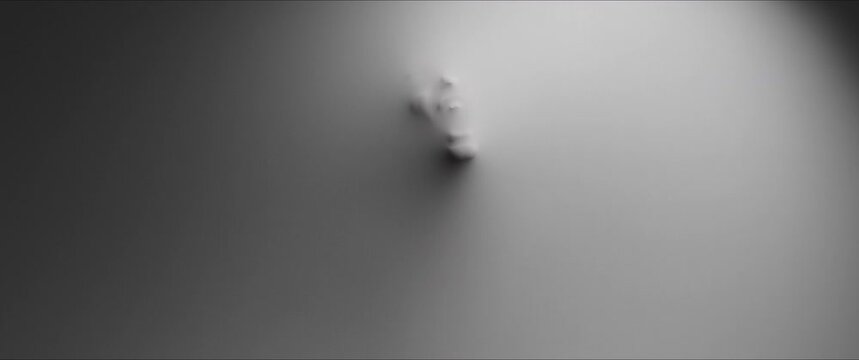 The shape of the woman's screaming face reveals itself from the white surface