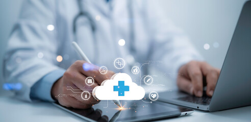 A medical worker work with technology cloud computing medical cross shape and Big Data Healthcare concept.Information technology computing medicine integration. Medical database, cloud server.