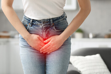 Woman suffering from cystitis symptoms indoors, closeup