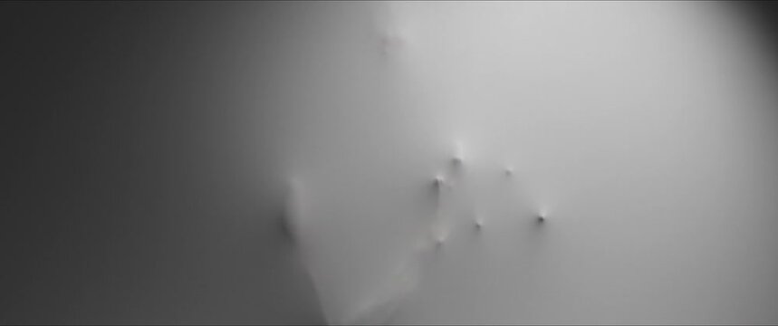 Creepy face and hand shapes appear from the white wall