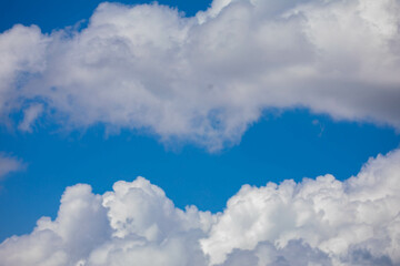 Clear blue sky with white clouds
