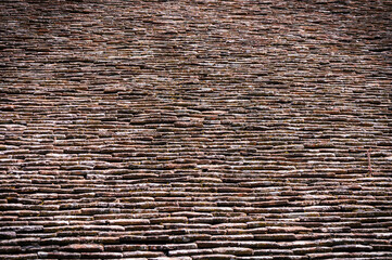 old tiles on the roof as a background