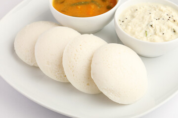 Idly sambar or Idli with Sambhar and green, red chutney. Popular South indian breakfast