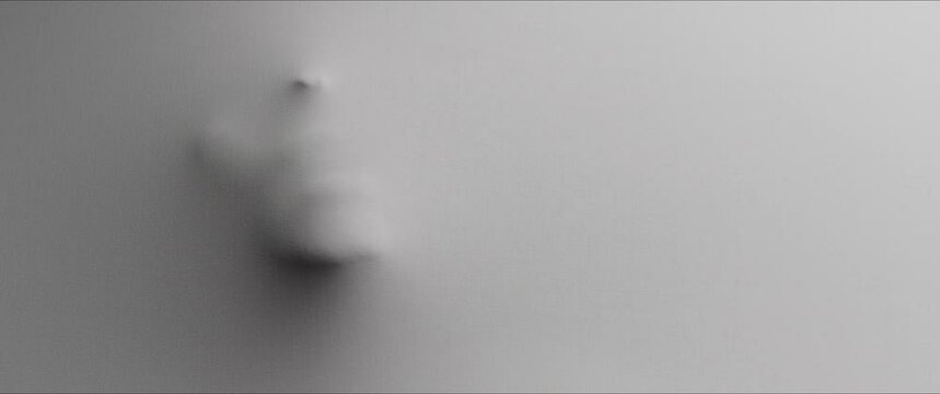 The shape of the skinny woman extrudes from the wall 