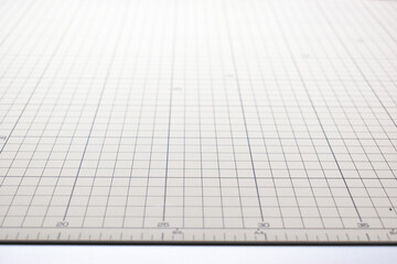 gray cutting mat board background with line and scale measure guide pattern for object art design,...