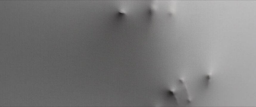 Skinny bonelike hands appears from the white surface