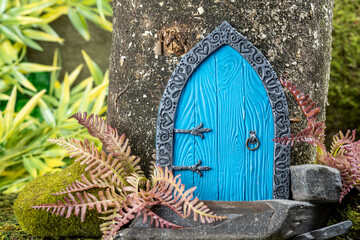 small door made of polymer clay on in nature like a fairy house close up
