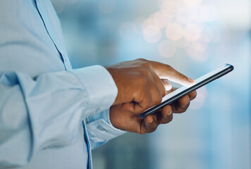 Black man, hands and browsing with phone for news, social media or online research at office. Closeup of African, male person or employee on mobile smartphone for chatting, texting or scrolling app