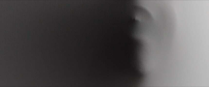 A creepy face with teeth appears from the white surface