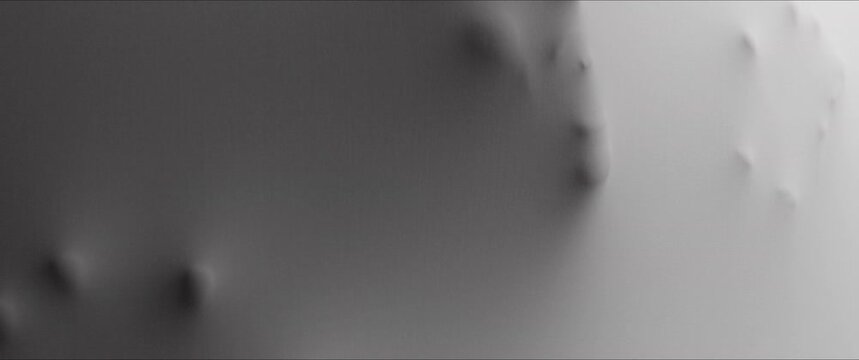 A scary face and hands appear from the white surface