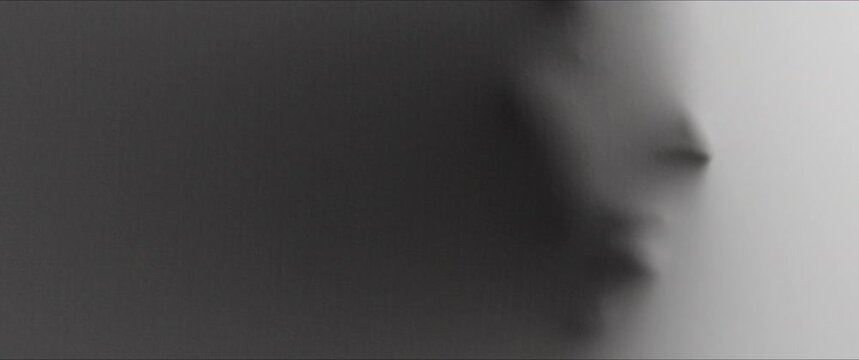 The shape of woman's face extrudes from the wall 