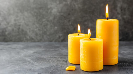 Burning candles on floor in darkness with space for text, on black background