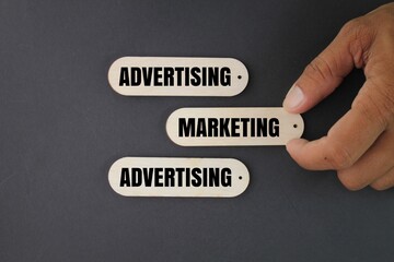 sticks with marketing or advertising words. hand picked marketing. business concept