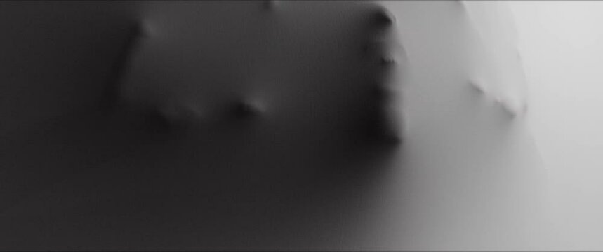 A  skinny woman's screaming face and hands appear from the wall surface w