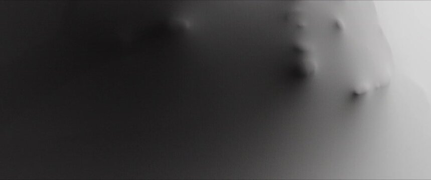 A skinny woman's scary face with teeth extrudes from the wall surface 