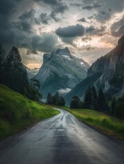 Winding Mountain Road Through Dramatic Stormy Landscape at Sunset