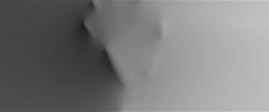 Human's hands extrude from the wall surface