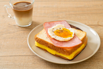 bread toasted cheese topped ham and fried egg with pork sausage