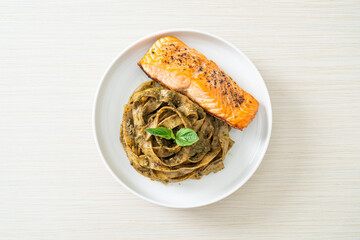 pesto fettuccine spaghetti pasta with grilled salmon fillet