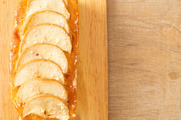 apple loaf crumbled on wood board