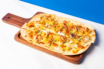 tart flambe seafood pizza on wood board