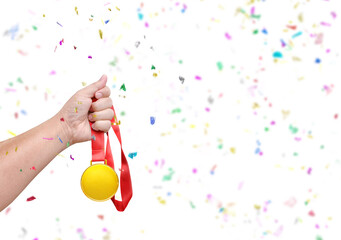 Holding a gold medal  celebrating success