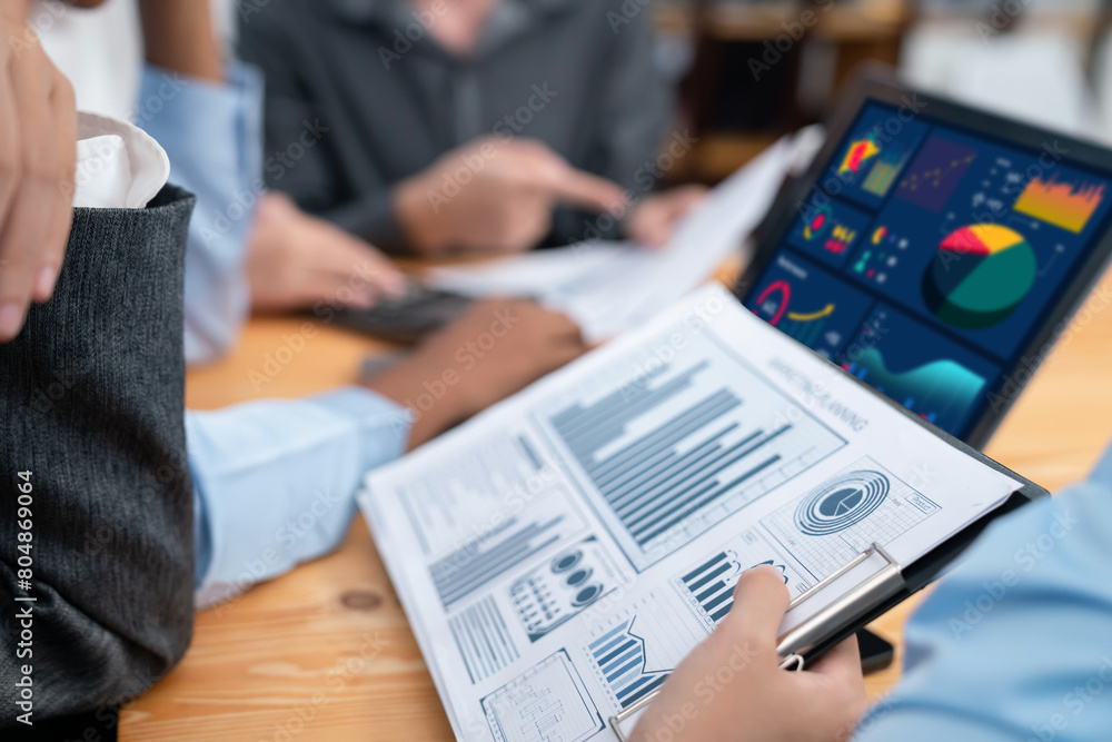 Aufkleber multiracial analyst team use bi fintech software to analyze financial data on meeting table. financi