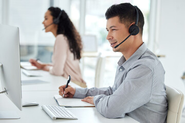 Call centre, man and notebook for customer service, headset or headphones in office, business and...