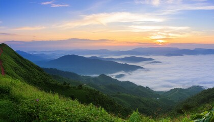 Naklejka premium green mountain with fog and sunrise twilight sky at background